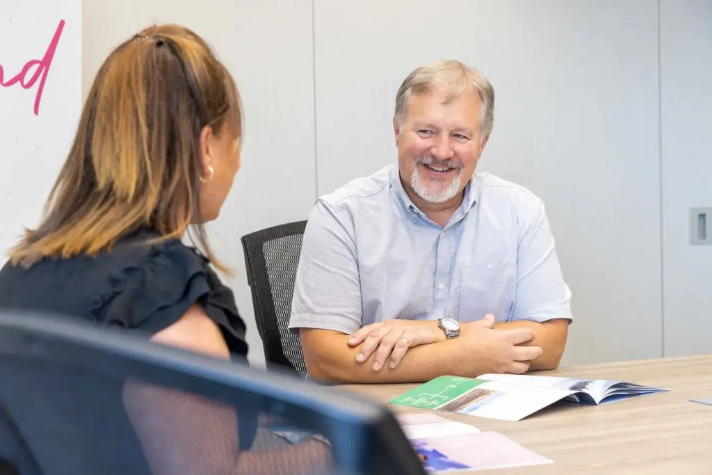 Corporate photography services capturing safety orientation for visitors, emphasizing branding