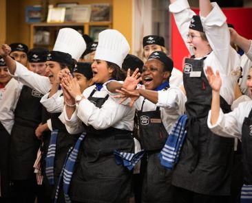 Students competing at the Fusion Faceoff cooking competition, captured by our video crew.