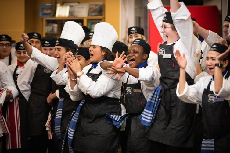 Students competing at the Fusion Faceoff cooking competition, captured by our video crew.